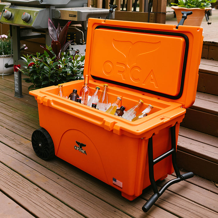 65 Quart Cooler, Blaze Orange, Lifestyle Backyard